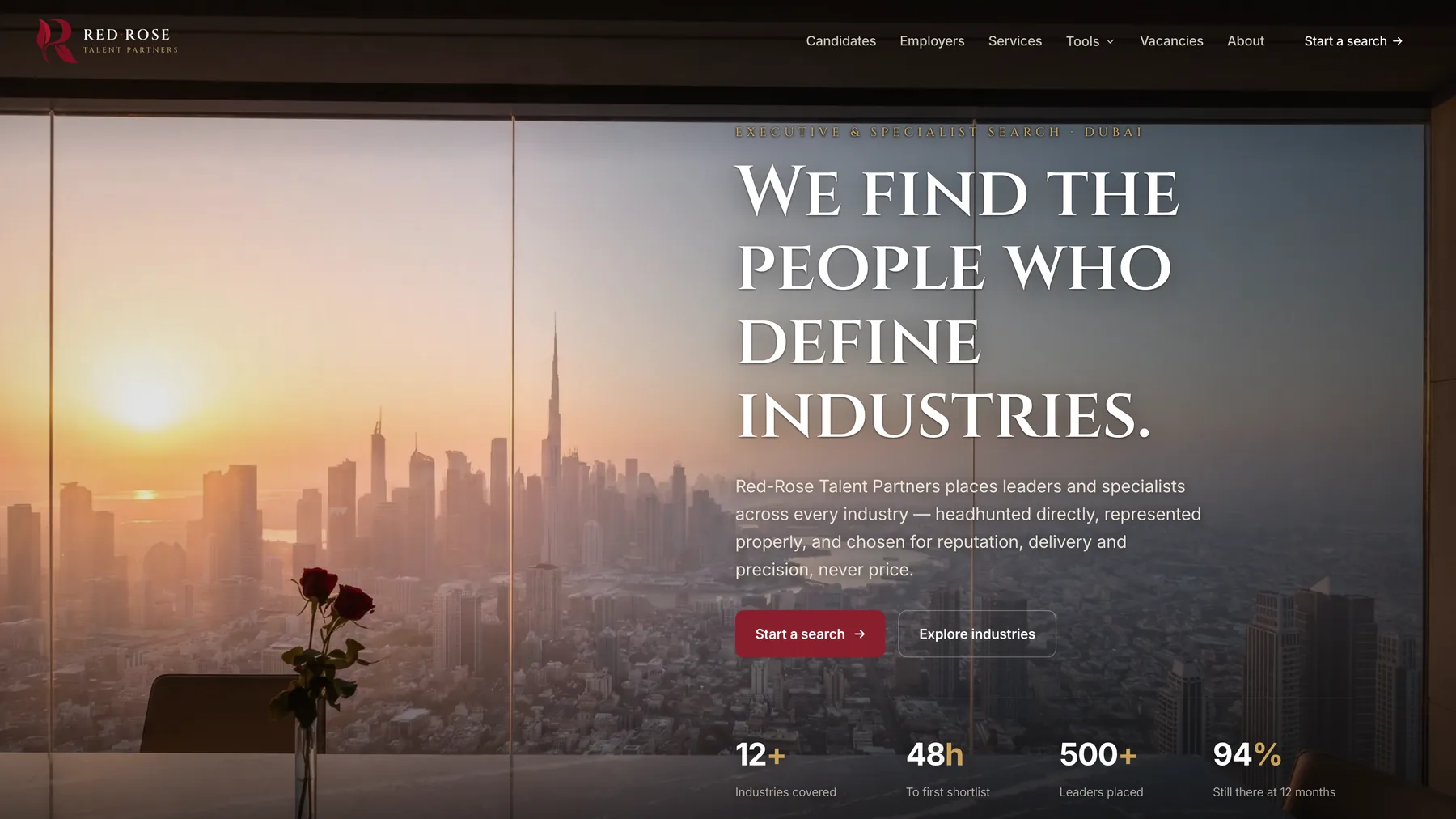 Red-Rose Talent Partners homepage showing a Dubai penthouse skyline at sunrise behind the headline We find the people who define industries